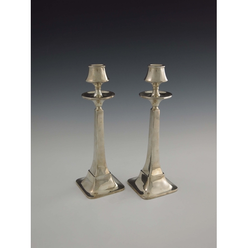 149 - A pair of Arts and Crafts silver candlesticks, W G Sothers Ltd., Birmingham 1923, square section spl... 