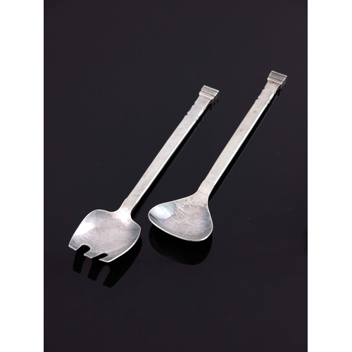 152 - Guild of Handicrafts, a pair of Arts and Craft silver salad servers, London 1939, planished and notc... 