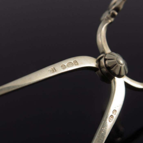 155 - Johan Rohde for Georg Jensen, a pair of sterling silver sugar tongs, pierced and stylised acorn hand... 