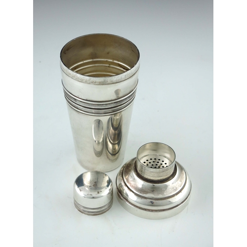 160 - An Art Deco silver plated cocktail shaker, conical form with central ribbed band, stepped shouldered... 