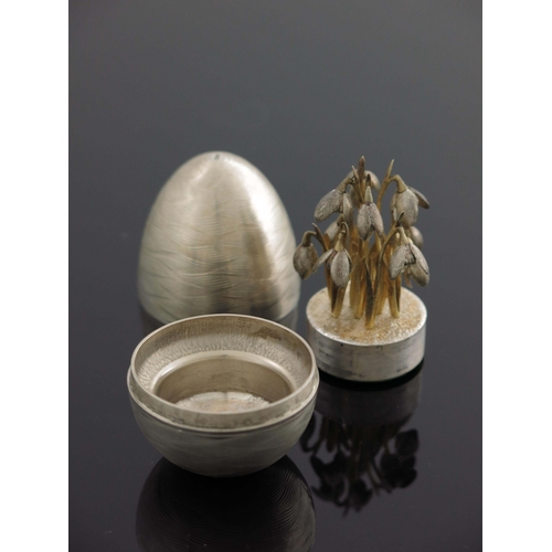 173 - A Modernist silver novelty surprise egg, Peter Nicholas and Co., London 1988, textured engine turned... 