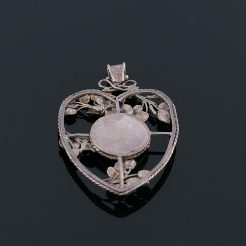 184 - An Arts and Crafts silver and mother of pearl pendant, in the style of John Paul Cooper, heart shape... 