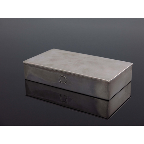 195 - Omega, a Swiss silver watch box, cuboid form, embossed with the Omega emblem, with hinged lid and ce... 