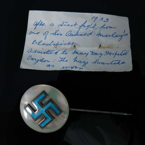 208 - A Swastika pin badge, enamel swastika mounted on mother of pearl and silver pin, Arthur Johnson Smit... 