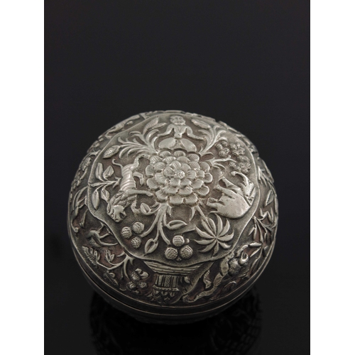 15 - An Indian white metal repousse box, probably Kutch, spherical form, chased and engraved with figures... 