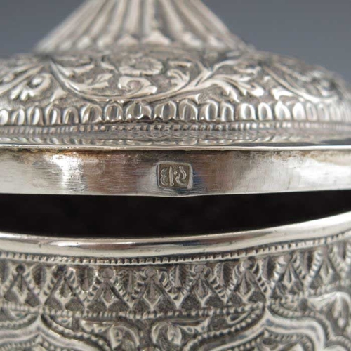 16 - An Indian Kutch silver box and cover, or tea caddy, 19th century, rounded bowl form, repousse emboss... 