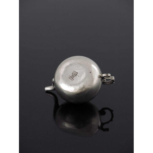 18 - A Dutch miniature silver teapot, Amsterdam 1755, spherical form with ogee lid, foliate S scroll hand... 