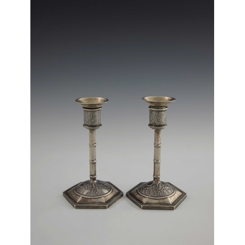 2 - A pair of Chinese export silver candlesticks, Wang Hing, Canton circa 1900, hexagonal section domed ... 