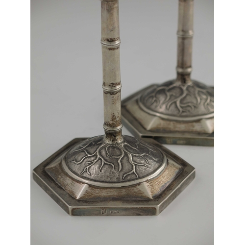 2 - A pair of Chinese export silver candlesticks, Wang Hing, Canton circa 1900, hexagonal section domed ... 