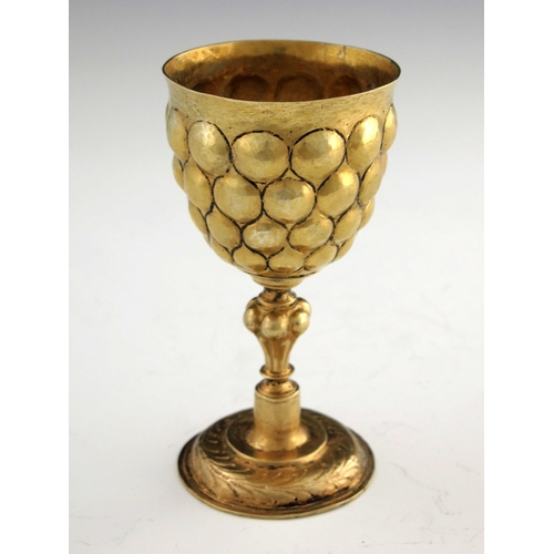 21 - A 17th century German silver gilt goblet, probably Nuremberg circa 1620, the rounded cup with emboss... 