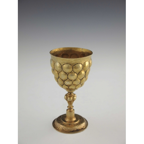 21 - A 17th century German silver gilt goblet, probably Nuremberg circa 1620, the rounded cup with emboss... 