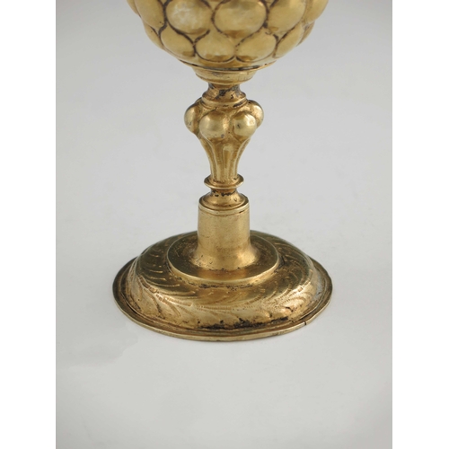 21 - A 17th century German silver gilt goblet, probably Nuremberg circa 1620, the rounded cup with emboss... 