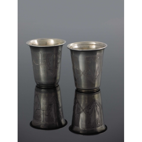 26 - A near pair of Ukrainian silver and parcel gilt beakers, Kiev circa 1890, flared form, engraved with... 