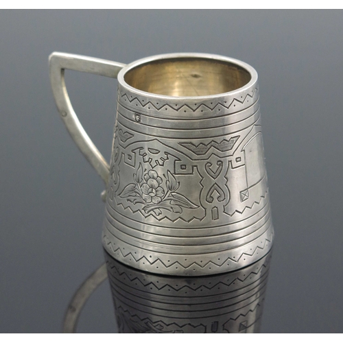 27 - An Imperial Russian silver mug, Aleksandr Fuld, Moscow 1880, conical form, engraved with geometric a... 