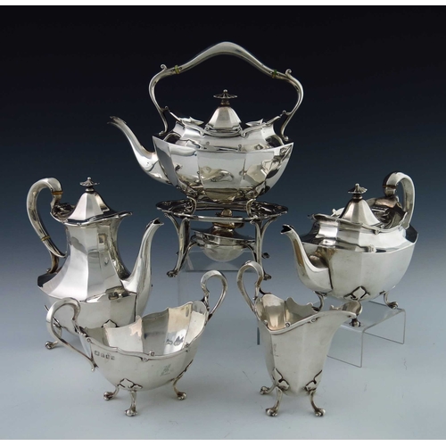 35 - A George V Scottish silver five piece tea set, George Edward and Sons, Glasgow 1913, faceted shoulde... 