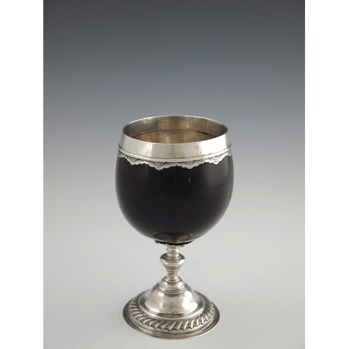 39 - A George III silver mounted coconut cup, James Phipps, London circa 1760, the polished nut with silv... 