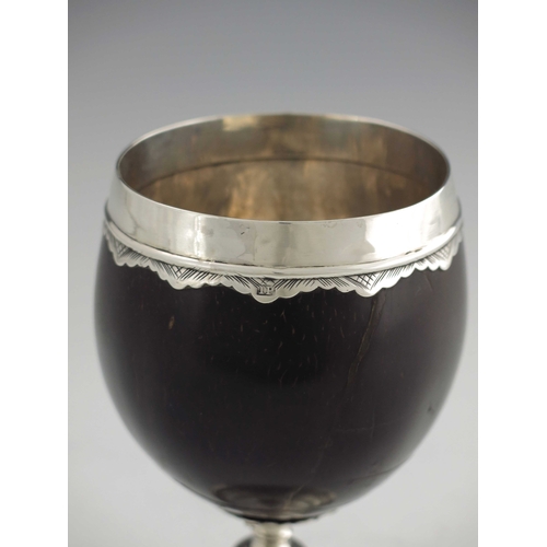 39 - A George III silver mounted coconut cup, James Phipps, London circa 1760, the polished nut with silv... 