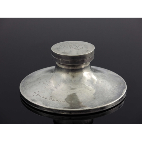 46 - A George V silver capstan inkwell, William Neale, Birmingham 1924, splayed form with hinged lid and ... 