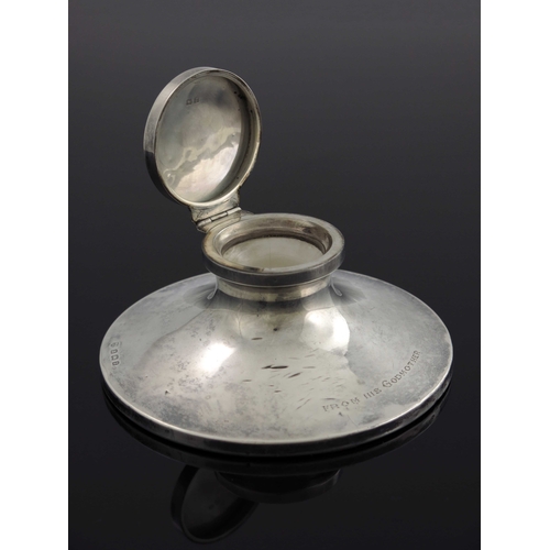 46 - A George V silver capstan inkwell, William Neale, Birmingham 1924, splayed form with hinged lid and ... 