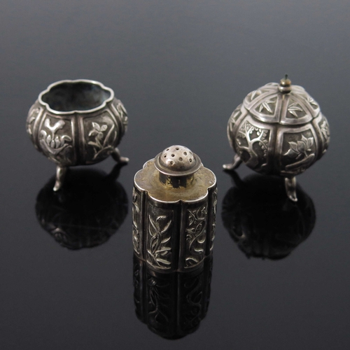 5 - A Chinese export silver three piece cruet, Tai Hua, circa 1900, lobed melon form mustard and salt ce... 