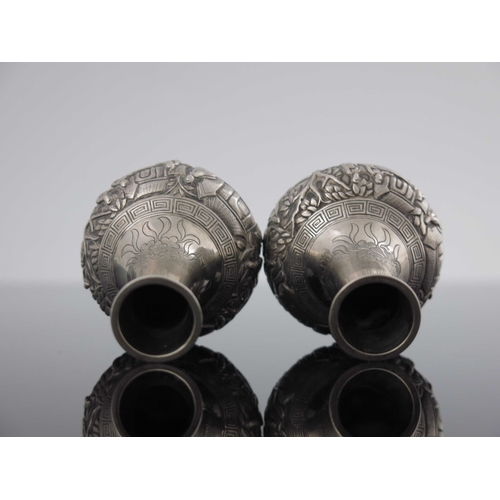 7 - A small pair of Chinese export silver vases, Wang Hing, Canton circa 1890, globe and shaft form, emb... 