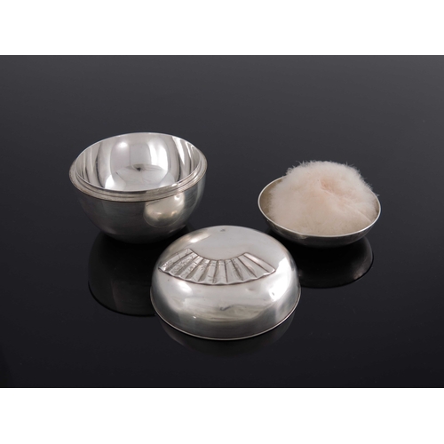 9 - A Japanese silver vanity box, ovoid form, double cased, the lid embossed to the outer shell with a f... 