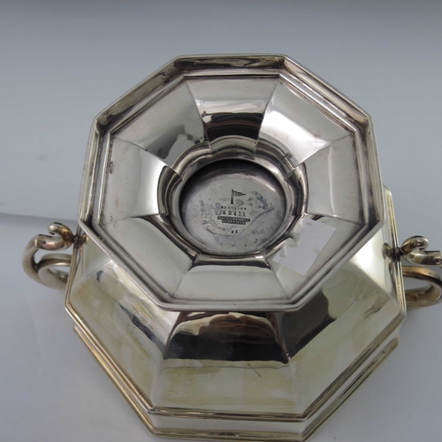 69 - A George V silver twin handled bowl, Walker and Hall, Sheffield 1927, banded octagonal section round... 