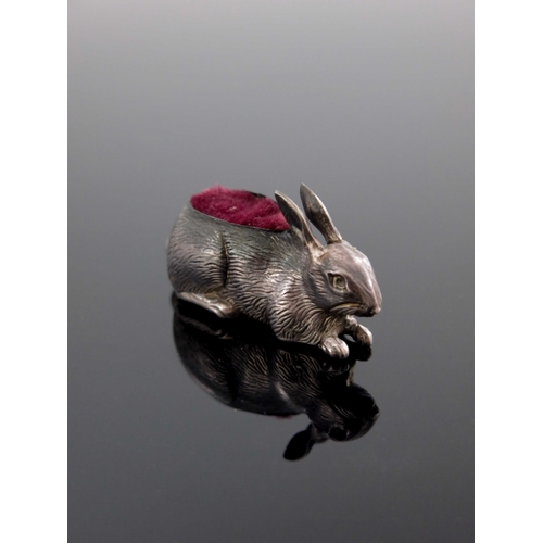 89 - An Edwardian novelty silver pin cushion, Adie and Lovekin, Birmingham 1907, modelled as a hare, lyin... 