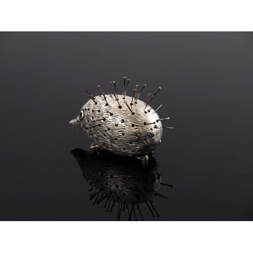 92 - An Edwardian novelty silver pin cushion, Levi and Salaman, Birmingham 1906, modelled as a hedgehog, ... 