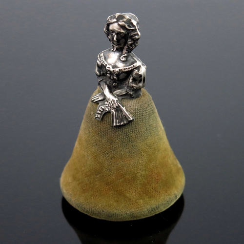 97 - A George V novelty silver pin cushion, Saunders and Shepherd, Chester 1911, in the form of a woman w... 