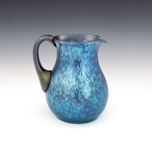 396 - Loetz, a Secessionist Cobalt Papillon iridescent glass jug, circa 1900, baluster form, with plain ha... 