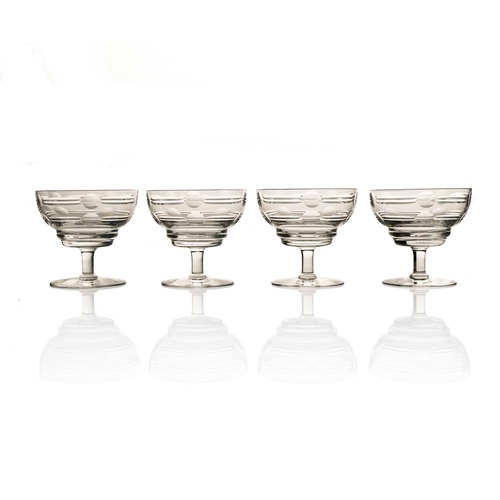 410 - Irene Stevens for Webb Corbett, a set of four Modernist cut glass dishes, ogee bowls cut with geomet... 