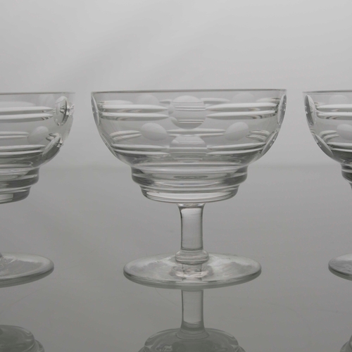 410 - Irene Stevens for Webb Corbett, a set of four Modernist cut glass dishes, ogee bowls cut with geomet... 