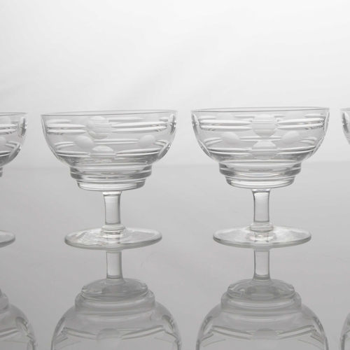 410 - Irene Stevens for Webb Corbett, a set of four Modernist cut glass dishes, ogee bowls cut with geomet... 