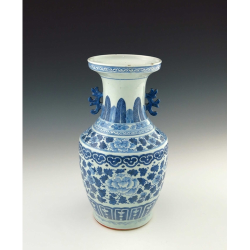 423 - A 19th Century Chinese provincial blue and white baluster vase, two-dimensional beast handles, the b... 