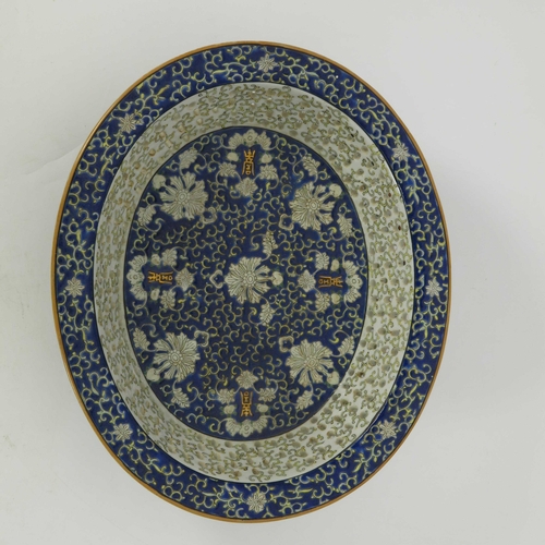 429 - A Chinese reticulated oval basket on matching stand, blue enamel decoration of scrollwork, white fol... 