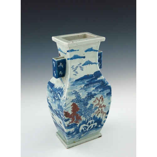 433 - A Chinese provincial blue and white baluster vase, 20th Century, of rectangular section with angular... 