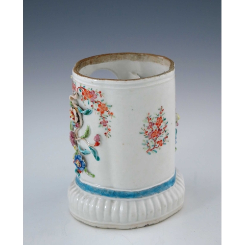 434 - An 18th Century Chinese porcelain watch stand, of cartouche from with applied foliage, polychrome an... 