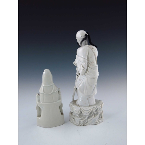 437 - A 19th Century Chinese blanc de chine figure, modelled as a standing elder with a wooden staff, real... 