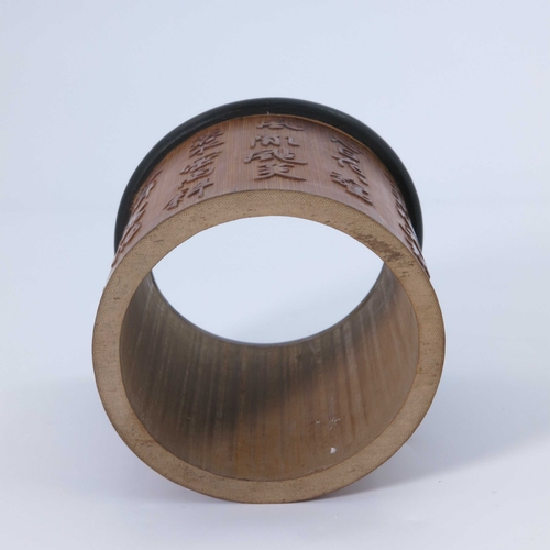 468 - A Chinese bamboo brush pot, the exterior carved with script in relief, 14cm high