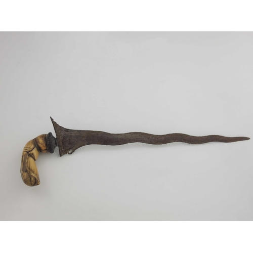 474 - A 19th century Polynesian Kris (Keris) knife, folded steel blade, with carved marine ivory Garuda ha... 