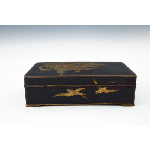 476 - A Japanese gilt metal and black lacquer table casket, early 20th Century, pagoda, reeds and bird dec... 