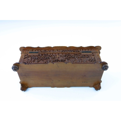 477 - A late 19th Century Cantonese wooden table casket, carved throughout with figures and pagodas in woo... 