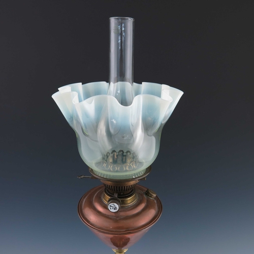 504A - W.A.S Benson, an Arts and Crafts copper and brass table oil lamp, circa 1890, wavy rim vaseline glas... 