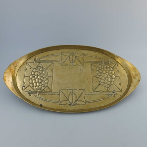 507 - Margaret Gilmour (attributed), a Glasgow School Arts and Crafts brass tray, oval form, repousse deco... 