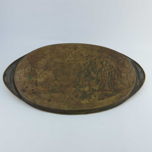 507 - Margaret Gilmour (attributed), a Glasgow School Arts and Crafts brass tray, oval form, repousse deco... 