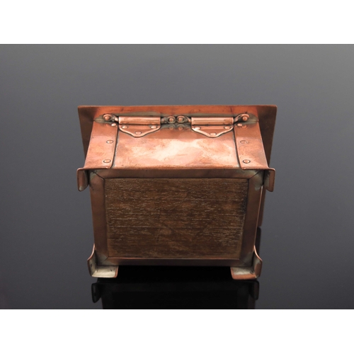 511A - A E Jones, an Arts and Crafts copper and enamelled casket, circa 1905, cuboid form with slightly dom... 