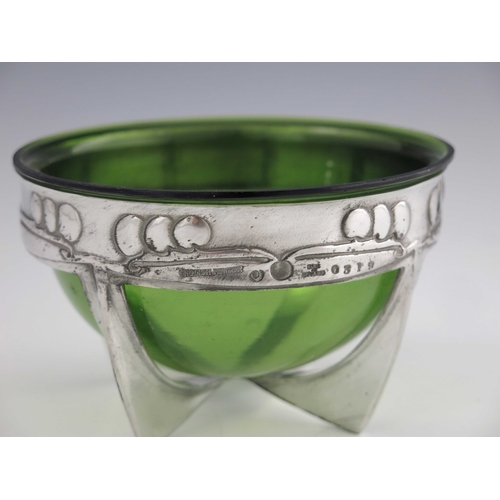 526 - Archibald Knox for Liberty and Co., an Arts and Crafts Tudric pewter and glass bowl, model 0319, cir... 