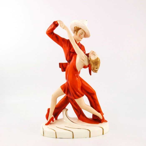 624 - Royal Dux, Tango Dancers, an Art Deco figure group, circa 1930, modelled in red outfits and hat, hig... 