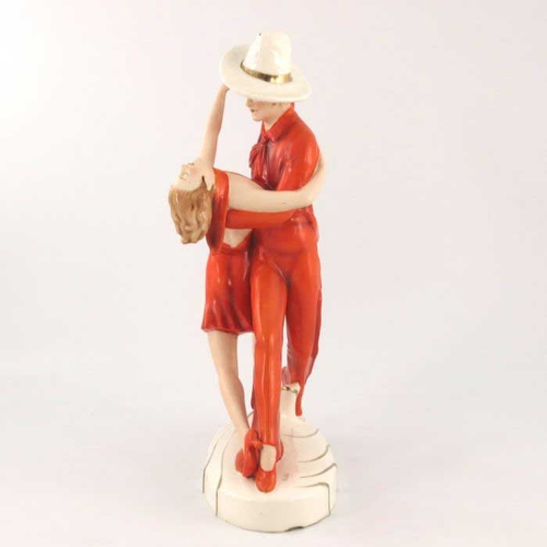 624 - Royal Dux, Tango Dancers, an Art Deco figure group, circa 1930, modelled in red outfits and hat, hig... 